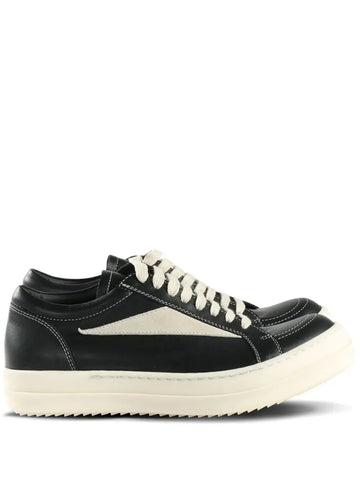 Rick Owens vintage sneakers in black leather with ivory contrast detailing, perfect for trendy urban outfits for 2025.