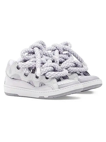 Lanvin Curb sneakers with snake laces, featuring trendy urban design for men and women, perfect for 2025 streetwear collections.