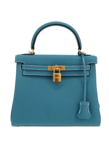 Hermès 2023 Kelly 25 handbag in blue leather with key fob and twist-lock, part of Empire Fits collections.